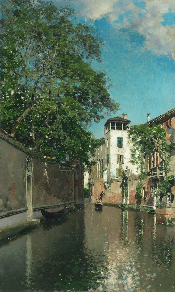 Canal in Venice by Martín Rico y Ortega: sunlight, trees, and old houses reflected in a Venetian canal.